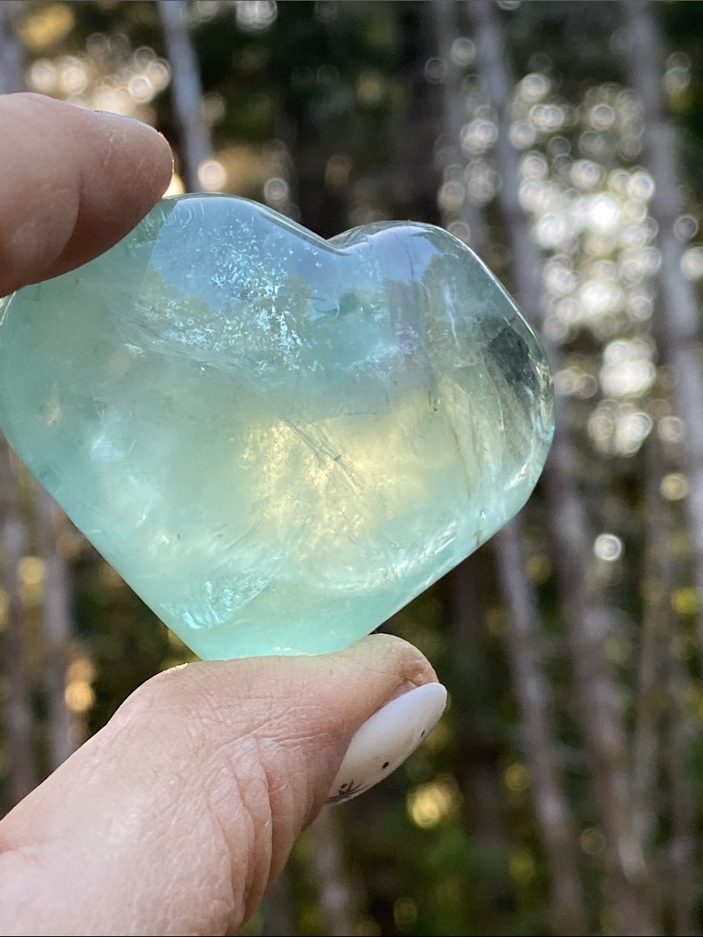Fluorite love heart shaped carving - clear focus